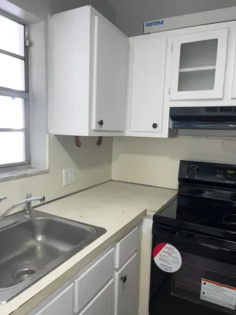 a kitchen with a stove and a microwave