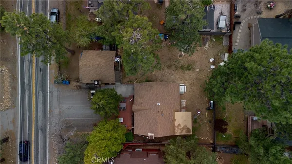 an aerial view of a house with outdoor space