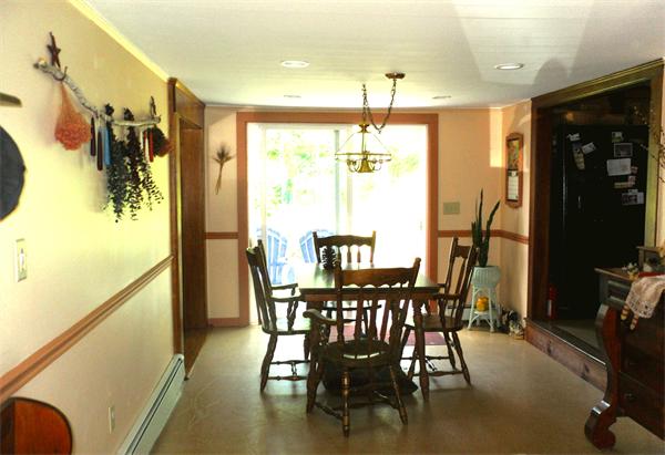 18 Barker Hill Road Townsend, MA 01469 - Photo 6 of 22 a view of a dining room with furniture and a window