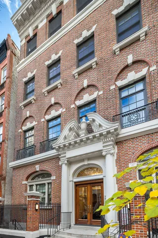 a front view of a building with street view