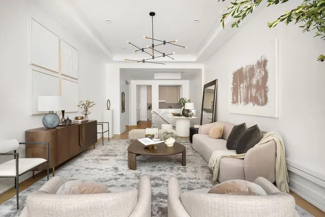 a view of a patio with a table and chairs and floor to ceiling window