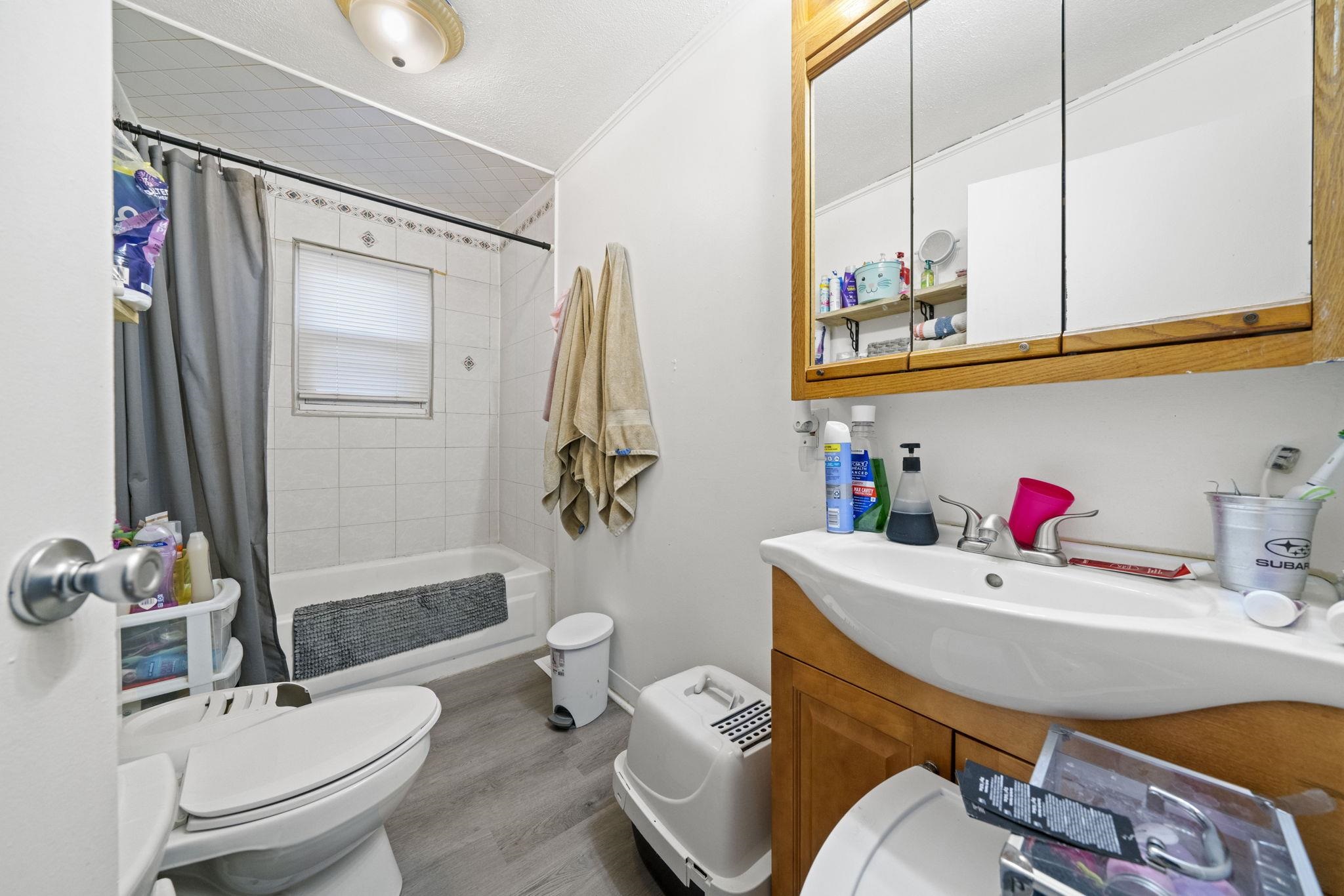 1884 Will James Road Rockford, IL 61109 - Photo 21 of 26 a bathroom with a sink toilet and shower