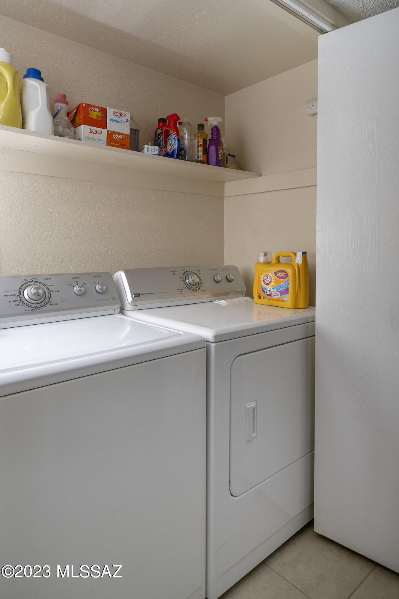 670 South Pantano Road, Unit E Tucson, AZ 85710 - Photo 15 of 17 a utility room with dryer and washer