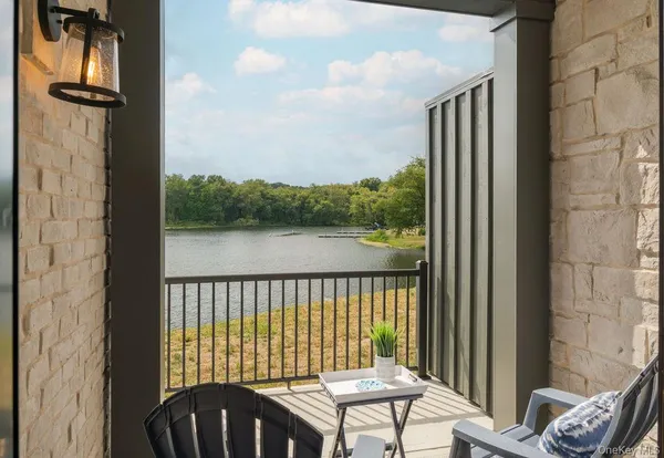 a view of a balcony with furniture