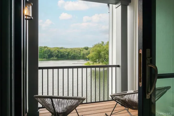 a view of a chair and table in the balcony