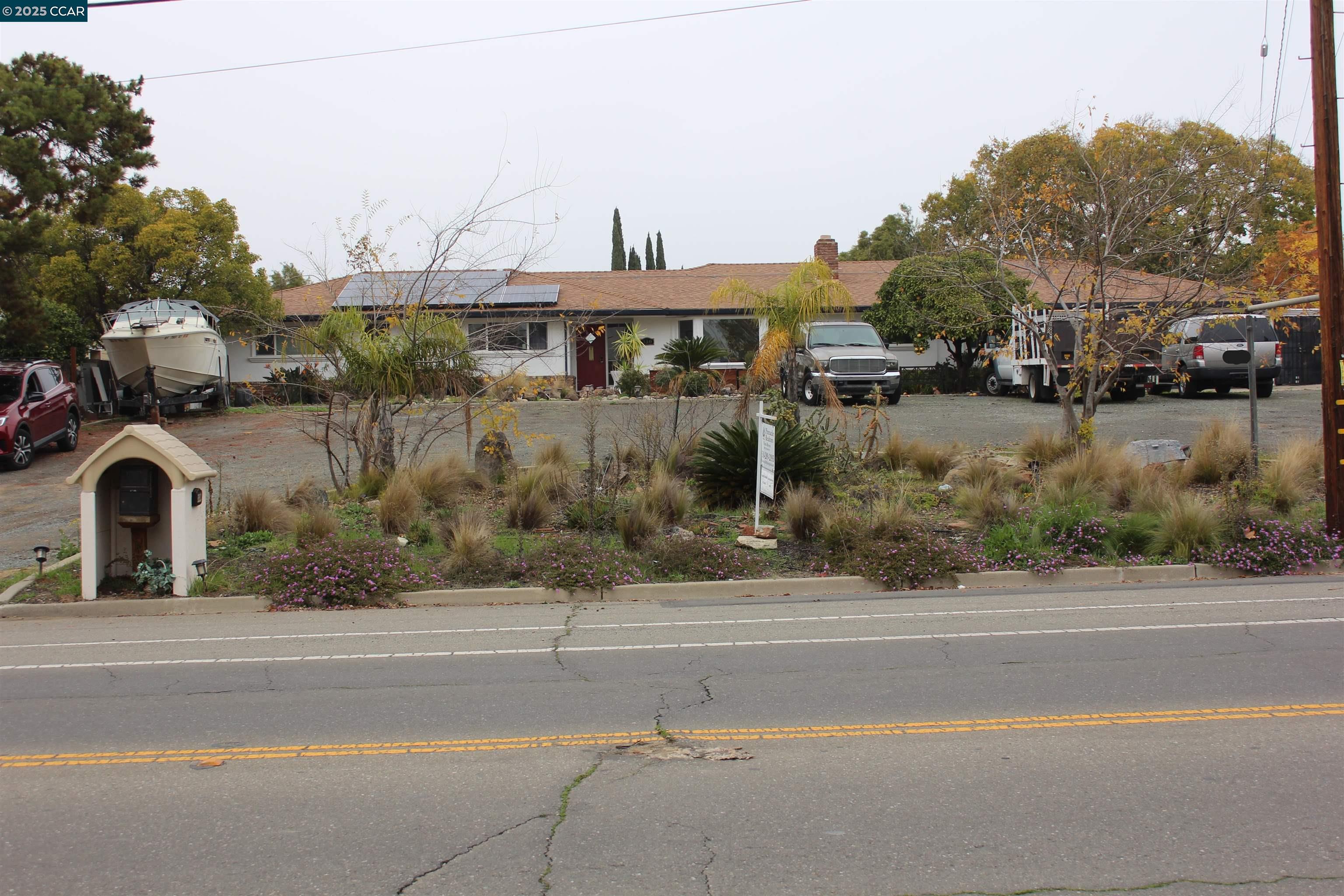 330 West Cypress Road Oakley, CA 94561 - Photo 11 of 12 a front view of a house with a garden