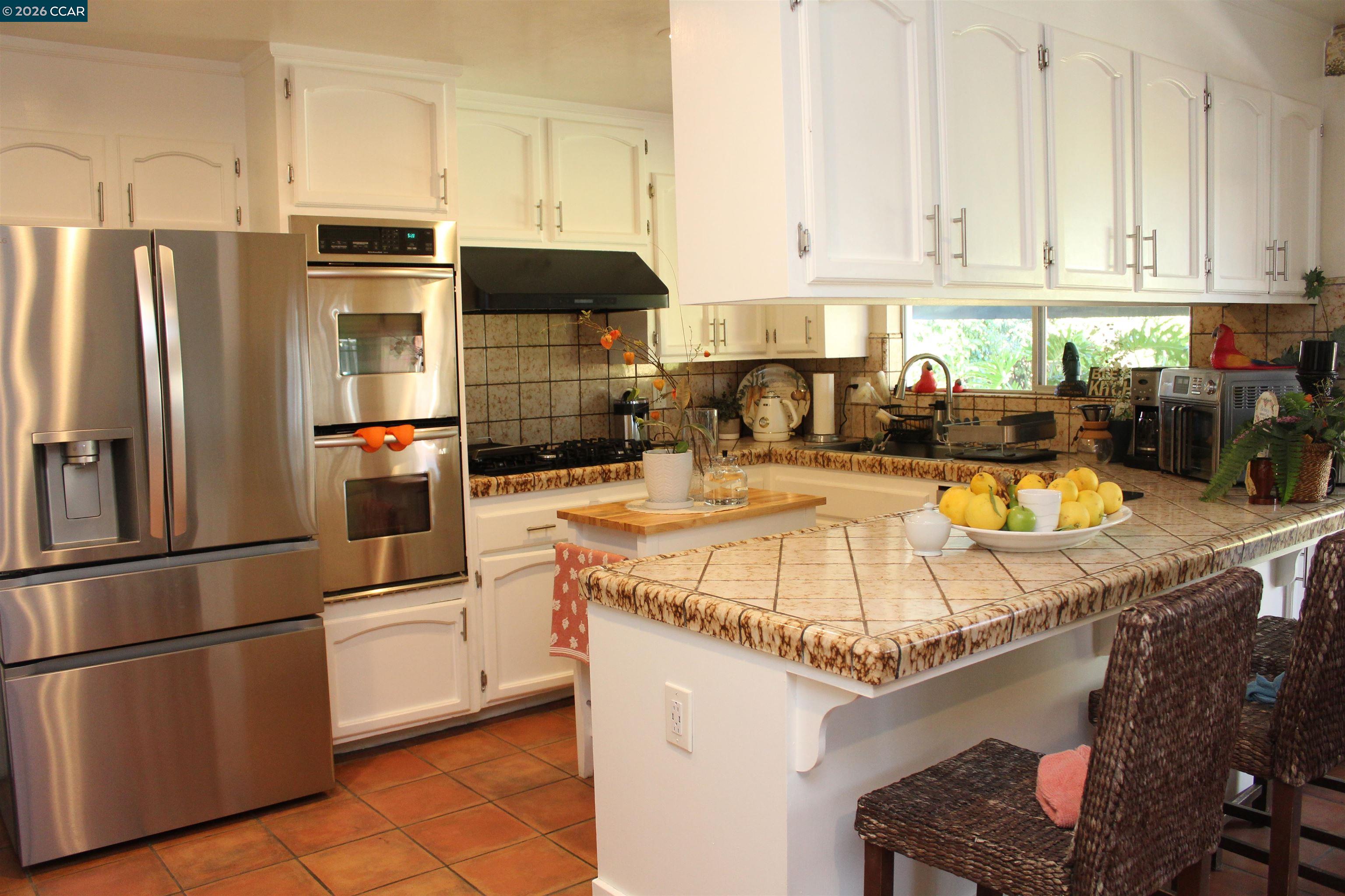 330 West Cypress Road Oakley, CA 94561 - Photo 16 of 59 a kitchen with stainless steel appliances granite countertop a refrigerator sink stove and microwave