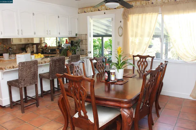 a view of a dining room with furniture and window