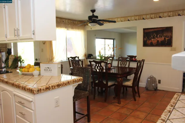 a white house with a sink and a mirror