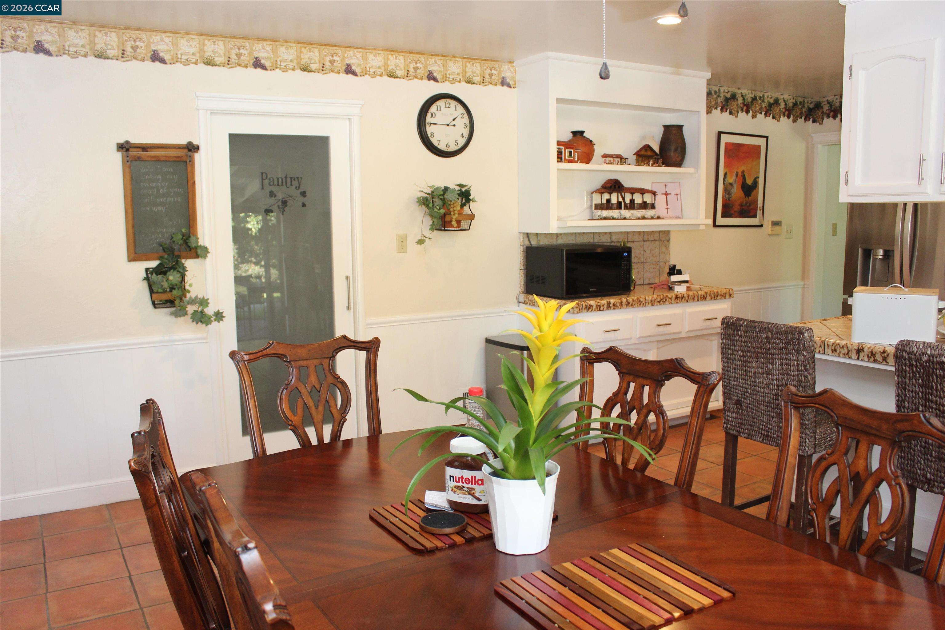 330 West Cypress Road Oakley, CA 94561 - Photo 24 of 59 a view of a dining room with furniture and wooden floor