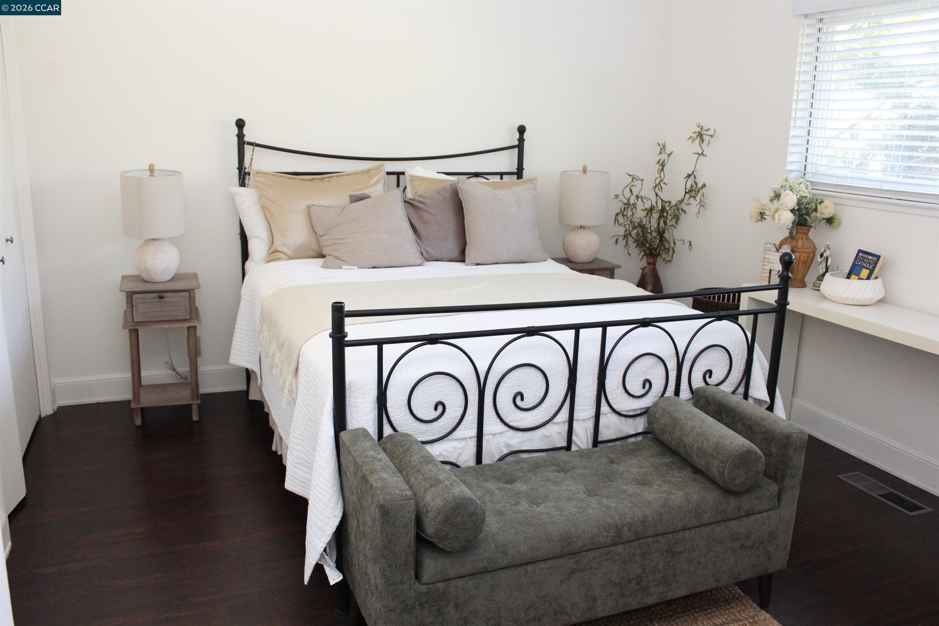 330 West Cypress Road Oakley, CA 94561 - Photo 36 of 59 a bedroom with a bed and a potted plant