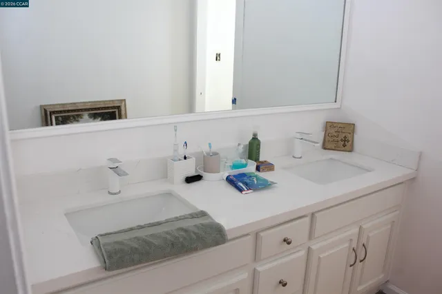 a view of a swimming pool with a garden in front of it