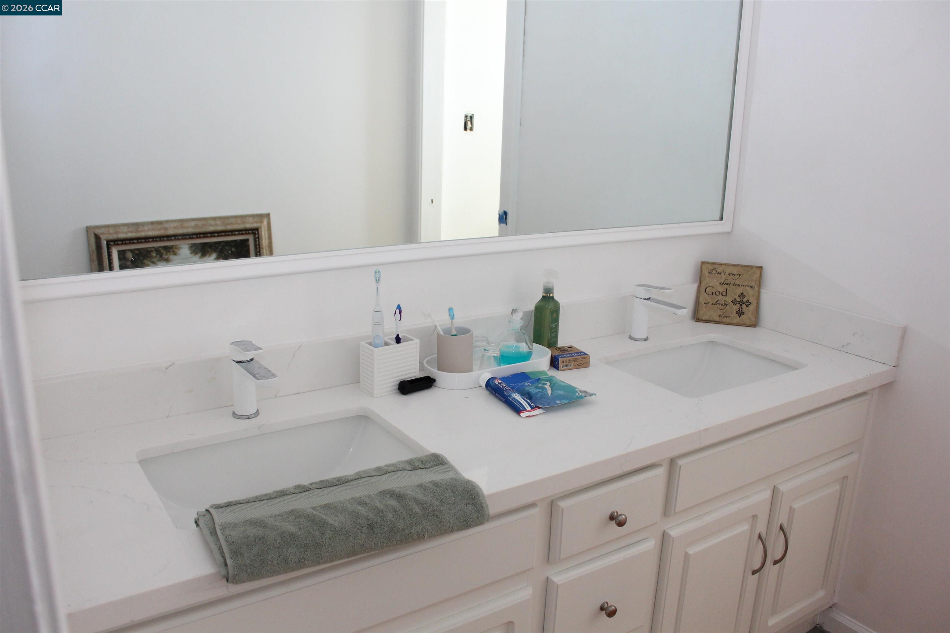 330 West Cypress Road Oakley, CA 94561 - Photo 39 of 59 a bathroom with a sink and a mirror