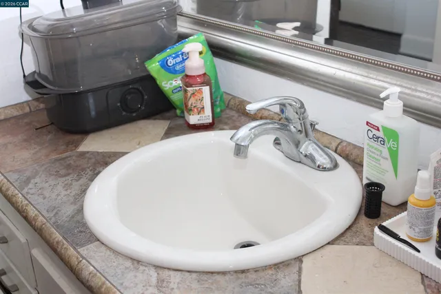 a view of patio with table and chairs and potted plants