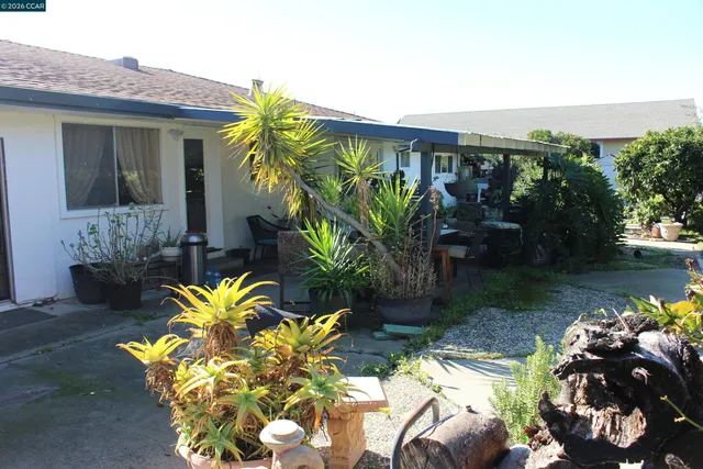 a view of an chairs and table in a balcony