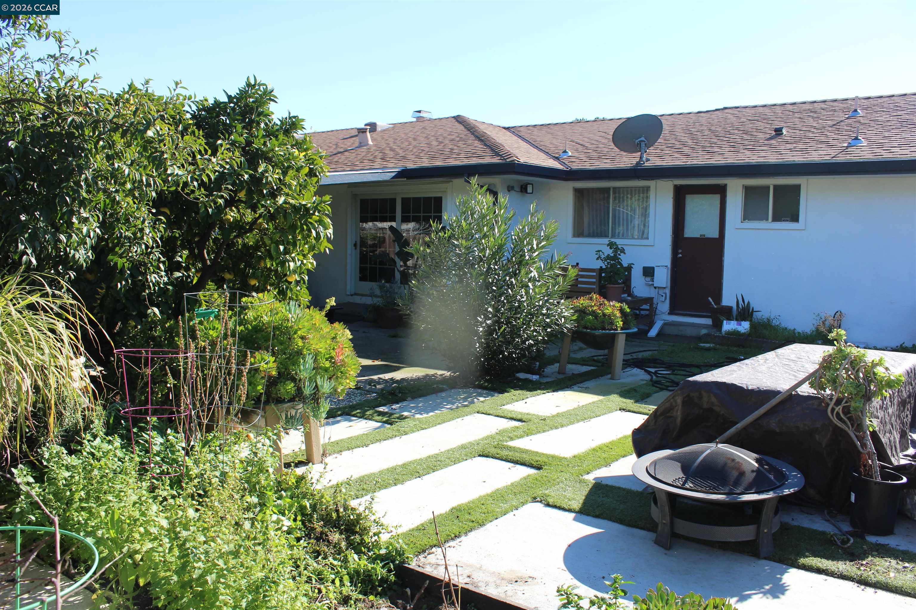 330 West Cypress Road Oakley, CA 94561 - Photo 49 of 59 a backyard of a house with fire pit and outdoor seating