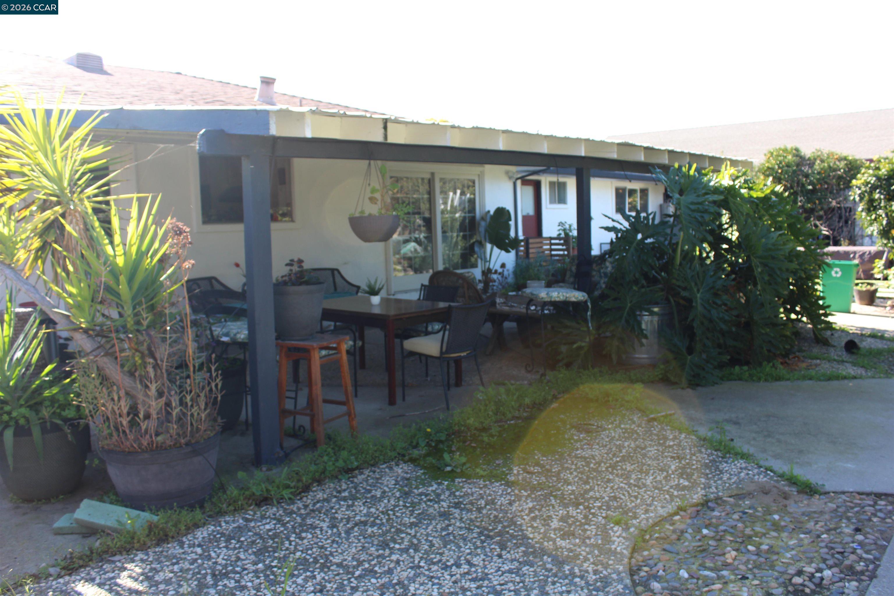 330 West Cypress Road Oakley, CA 94561 - Photo 55 of 59 a backyard of a house with garden and outdoor seating
