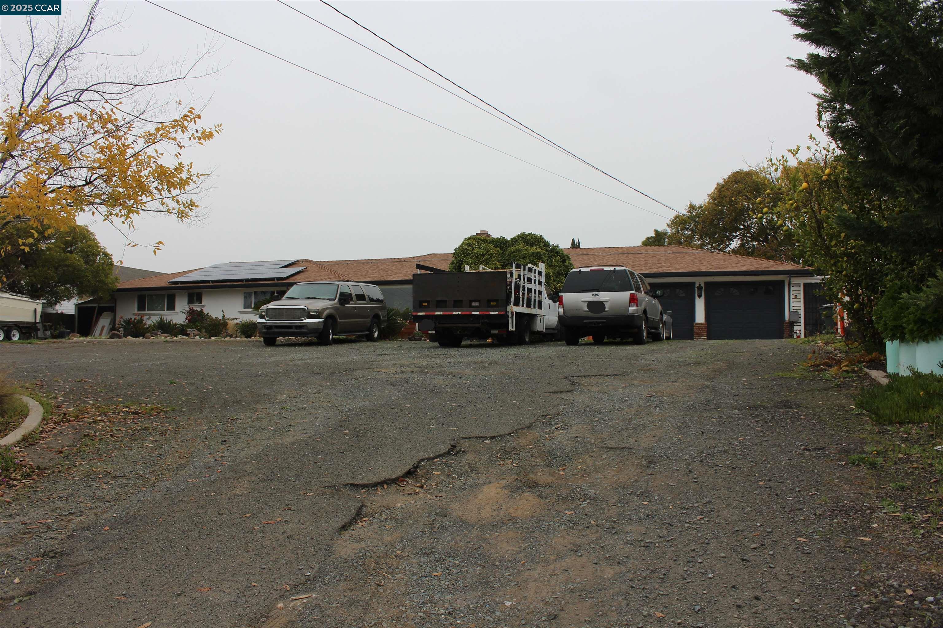330 West Cypress Road Oakley, CA 94561 - Photo 7 of 12 a car parked in front of a house