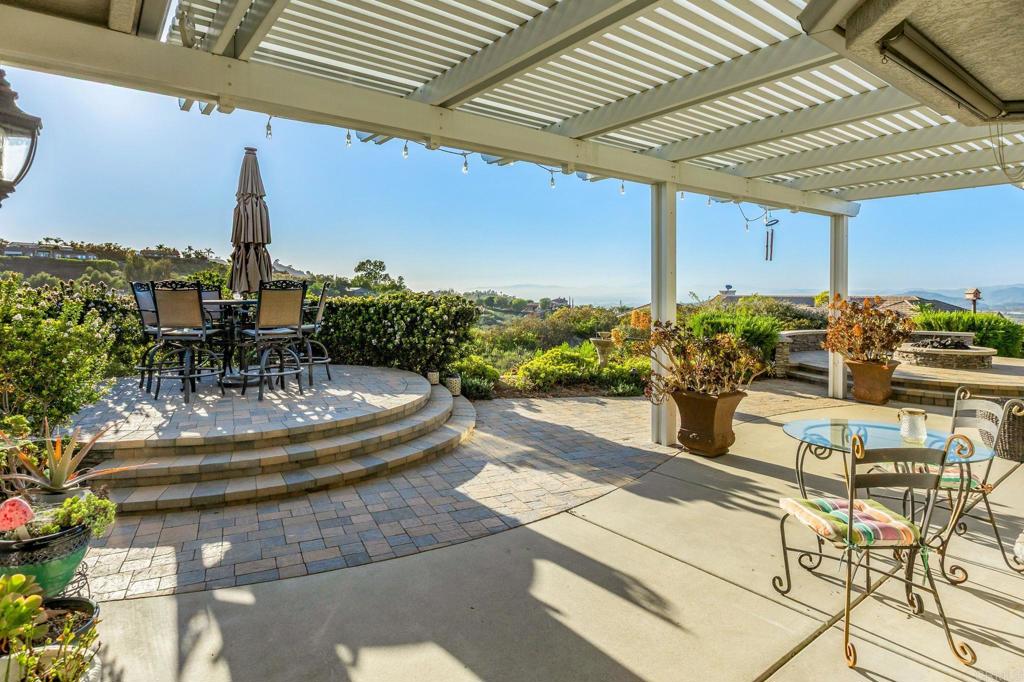 28623 Willow Park Road Escondido, CA 92026 - Photo 13 of 21 a view of a patio with a table and chairs potted plants