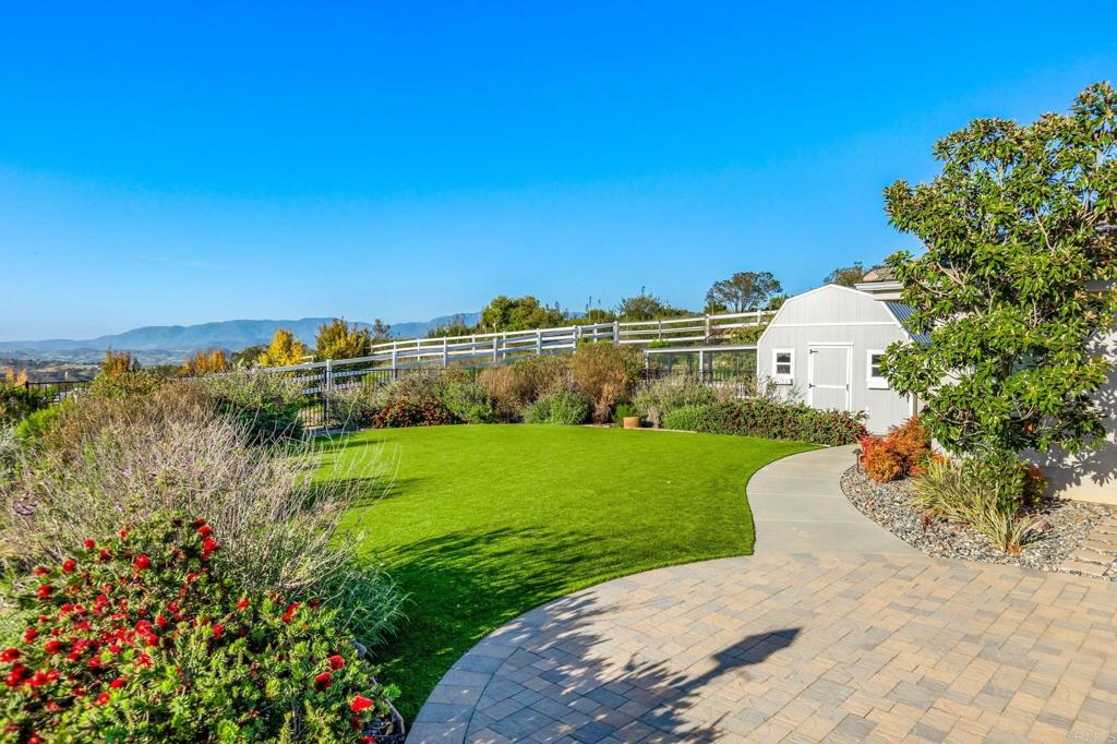 28623 Willow Park Road Escondido, CA 92026 - Photo 14 of 21 a view of a garden with a building in the background