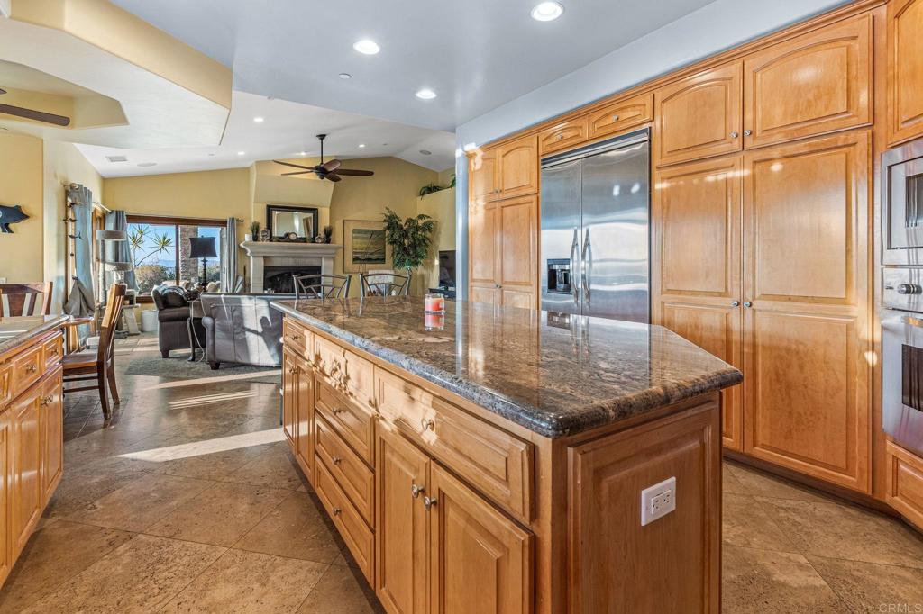 28623 Willow Park Road Escondido, CA 92026 - Photo 5 of 21 a kitchen with kitchen island granite countertop a large counter top and stainless steel appliances