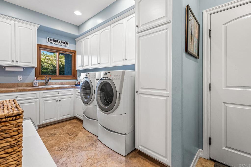 28623 Willow Park Road Escondido, CA 92026 - Photo 7 of 21 a utility room with sink dryer and washer