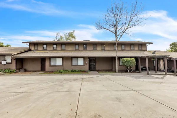 a front view of a house with glass windows