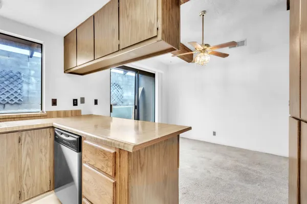 a kitchen with a sink cabinets and appliances