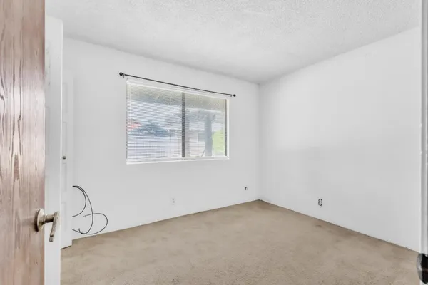 a view of a room that has a window in it