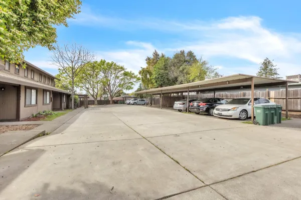 a front view of a house with trees