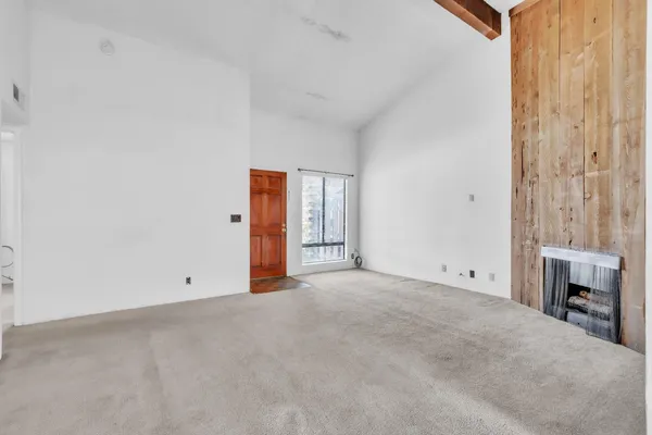 an empty room with fireplace