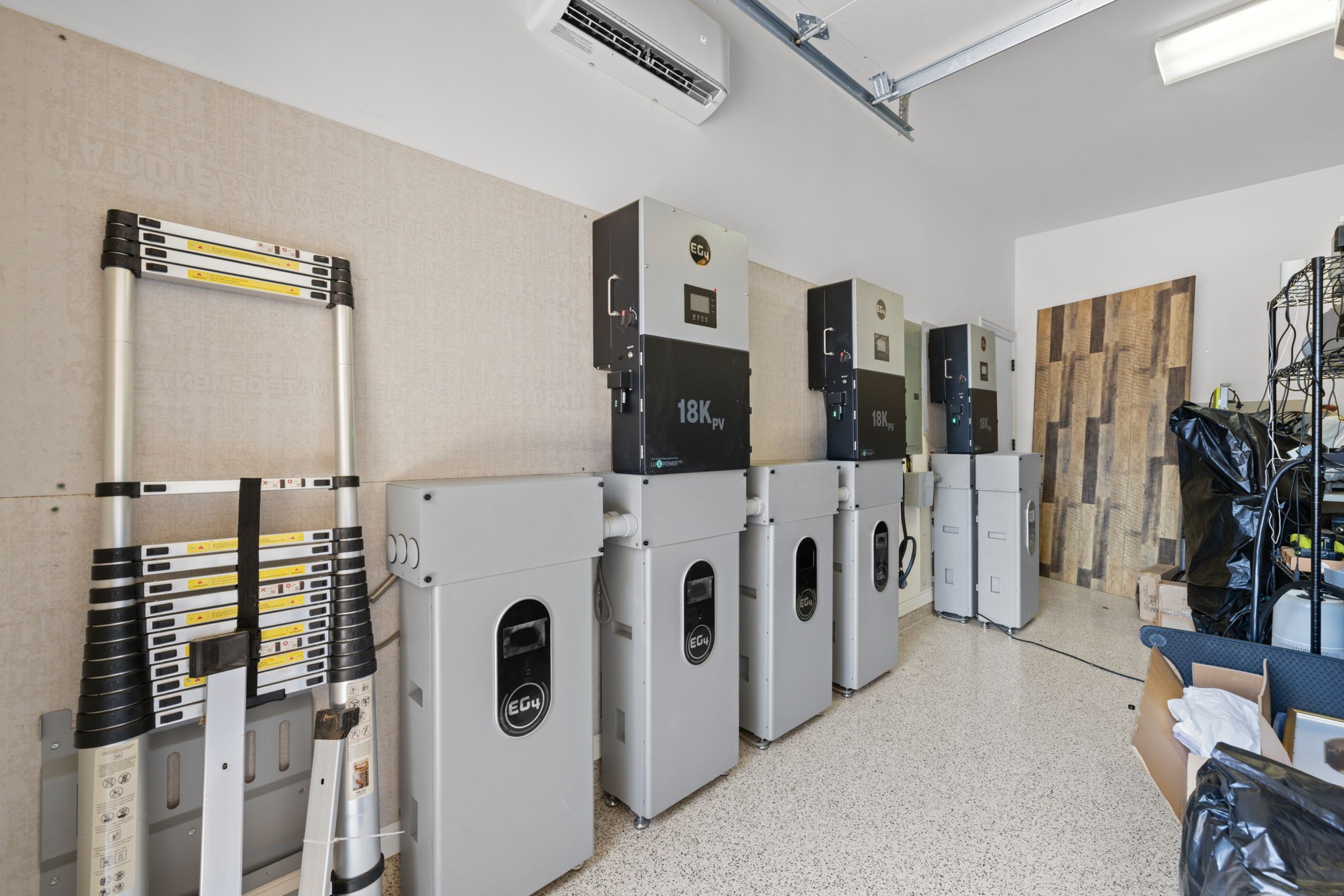 58 Shadow Creek Ridge Drive Spring, TX 77389 - Photo 48 of 49 Whole home battery bank located in the 3rd garage! Provides 2 weeks of power. Charges at night and home runs on the battery during the day for a huge savings! This can be removed or is negotiable to buyers who would like it to stay.