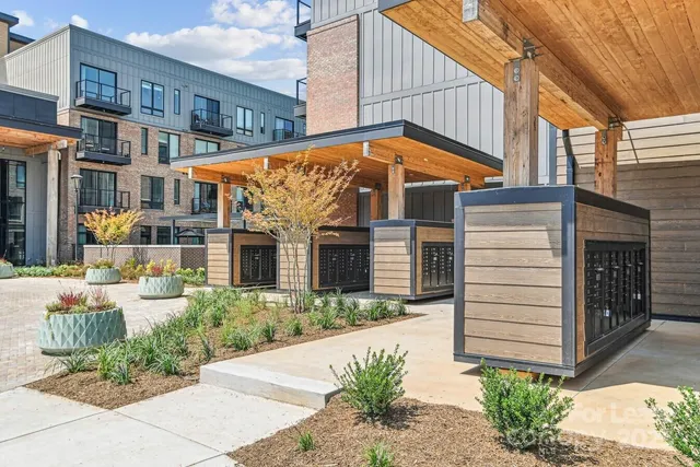 a view of a house with a yard and plants
