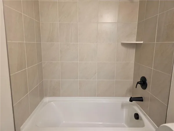 a close up of a bathtub in a bathroom