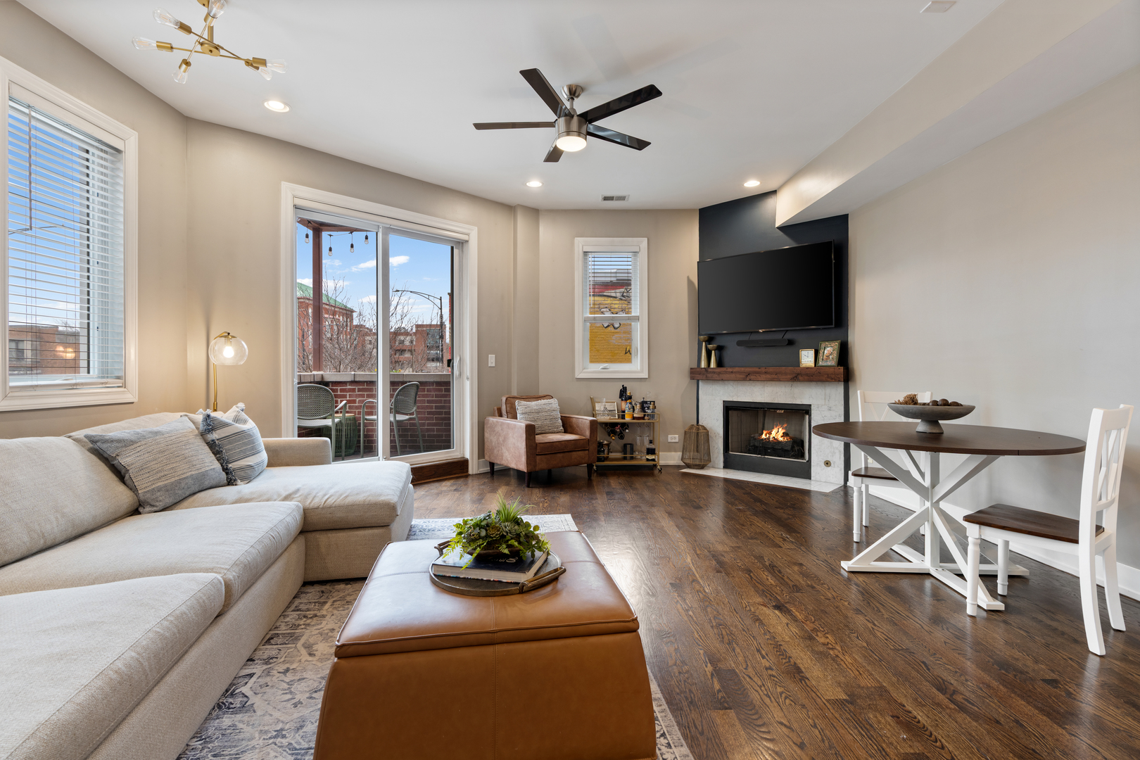 1816 West Division Street, Unit 2S Chicago, IL 60622 - Photo 4 of 16 a living room with furniture a flat screen tv and a large window