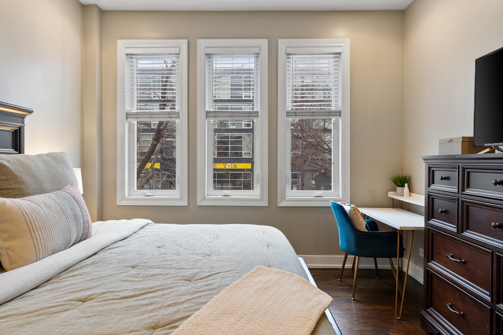 1816 West Division Street, Unit 2S Chicago, IL 60622 - Photo 8 of 16 a bedroom with a bed a table and a window