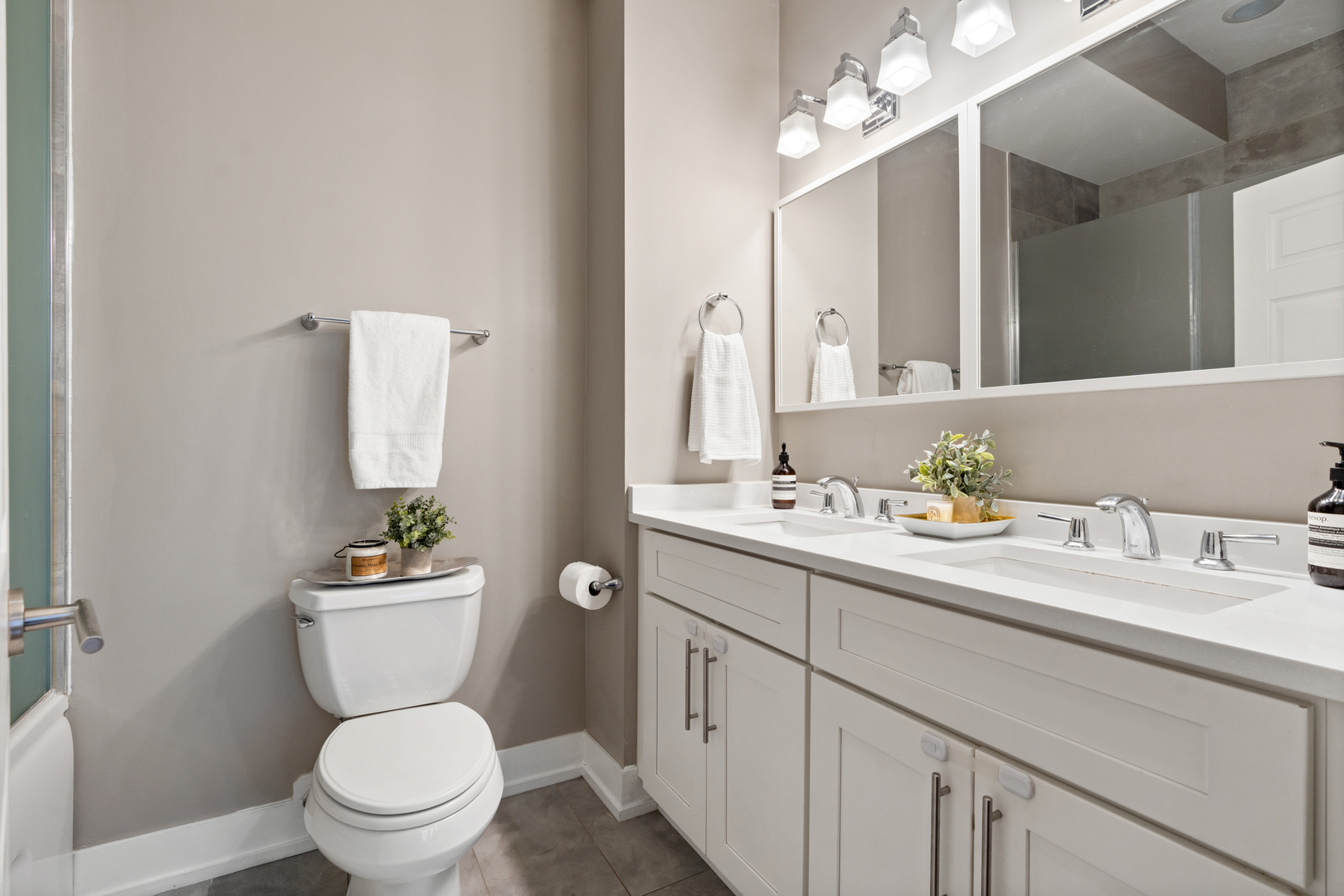 1816 West Division Street, Unit 2S Chicago, IL 60622 - Photo 9 of 16 a bathroom with a toilet a sink and mirror