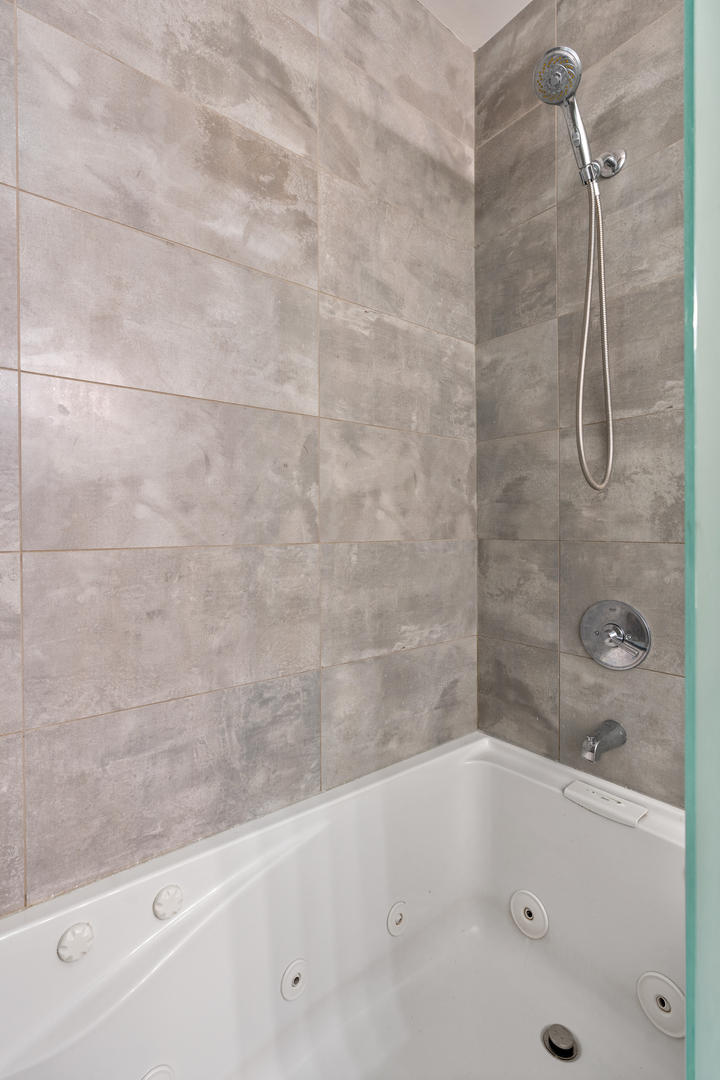 1816 West Division Street, Unit 2S Chicago, IL 60622 - Photo 10 of 16 a bathroom with a bathtub and shower