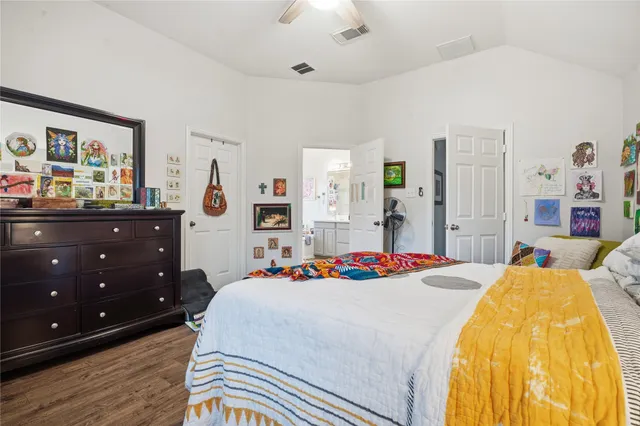 a view of a house with a big yard and large trees