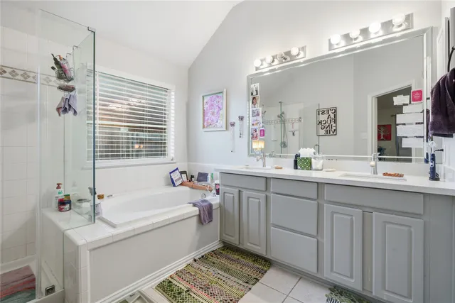 a view of a chair and table in backyard of the house