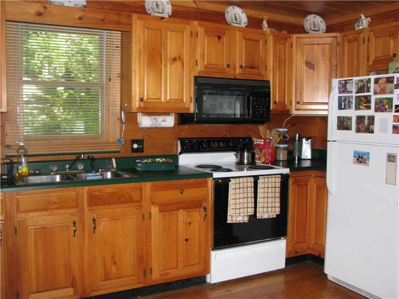 167 Crystal Spring Lane, Unit 20 Rome, ME 04963 - Photo 4 of 31 Kitchen. Custom kitchen with wood...