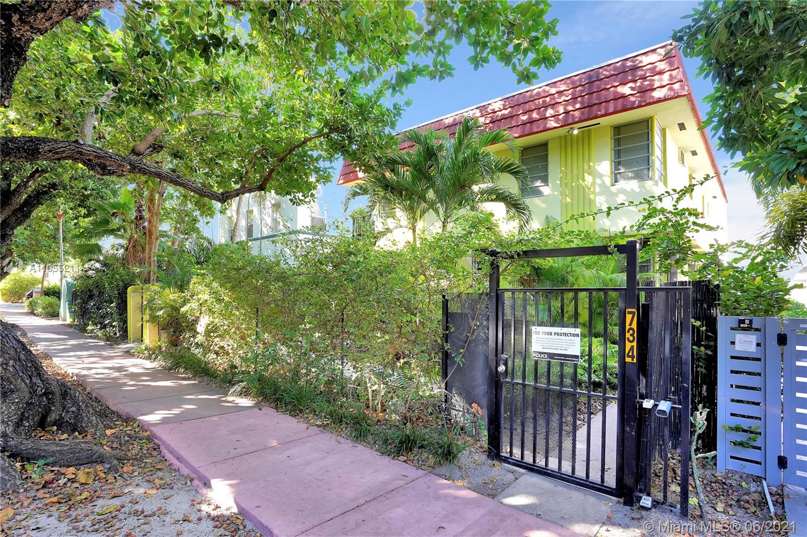 734 Meridian Avenue, Unit 4 Miami Beach, FL 33139 - Photo 12 of 12 a front view of a house with a yard