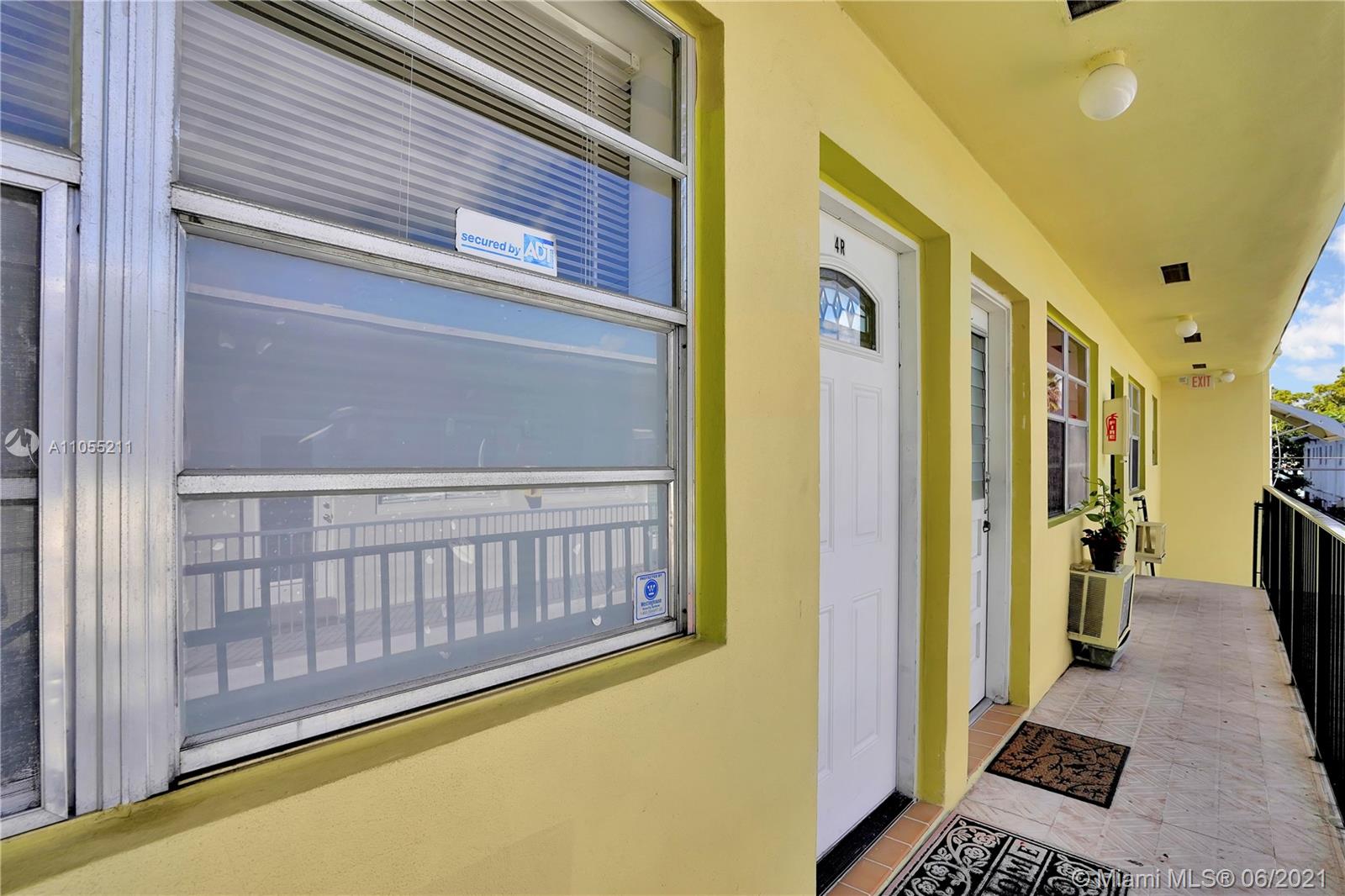734 Meridian Avenue, Unit 4 Miami Beach, FL 33139 - Photo 9 of 12 a view of a balcony with furniture and a rug