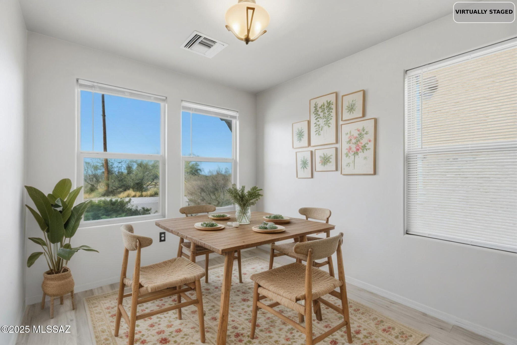 1458 North Wentworth Road Vail, AZ 85641 - Photo 42 of 44 a dining room with furniture potted plants and wooden floor