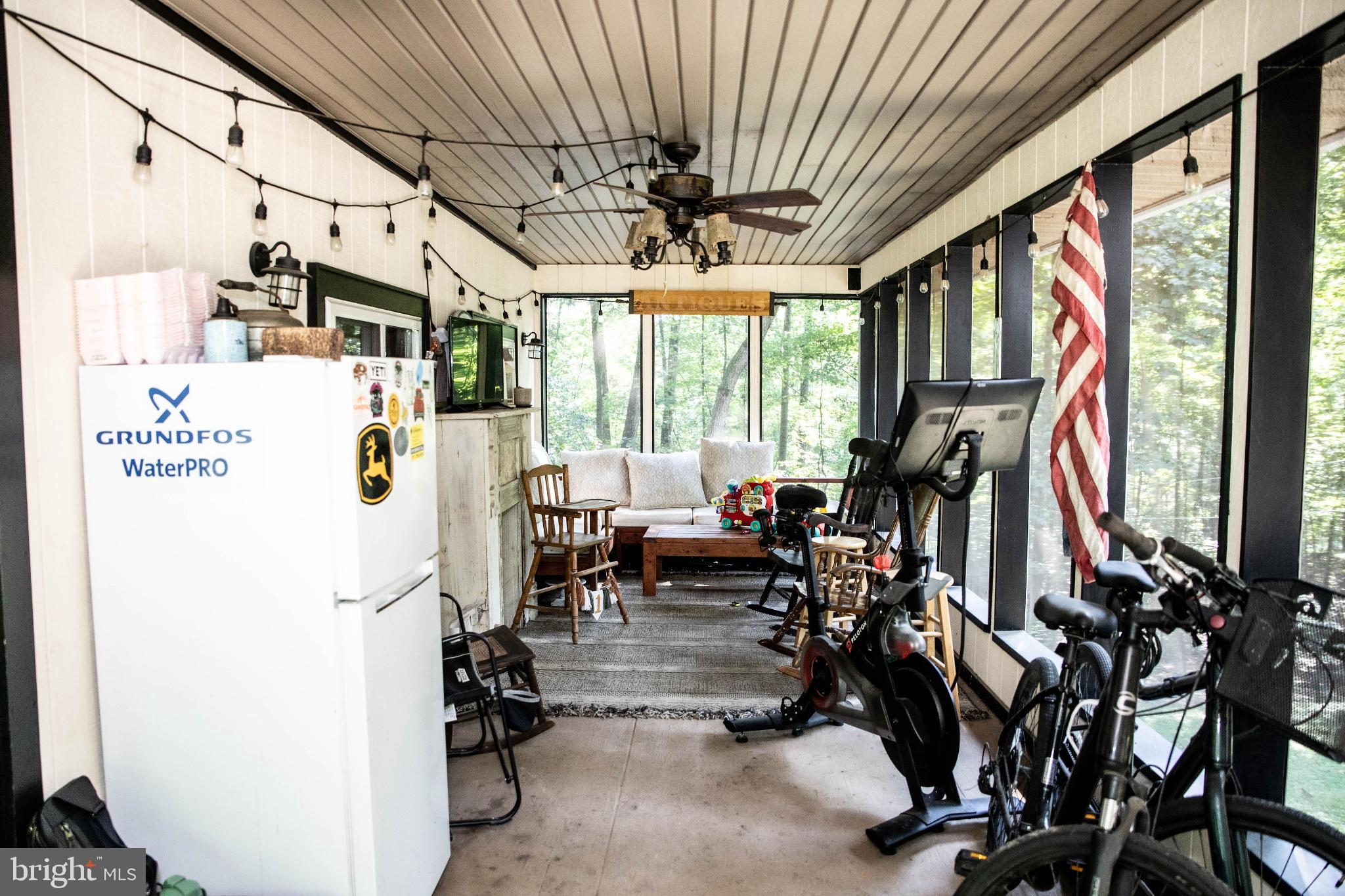 398 Acorn Road Millerstown, PA 17062 - Photo 19 of 42 Inviting screened porch with rustic charm.