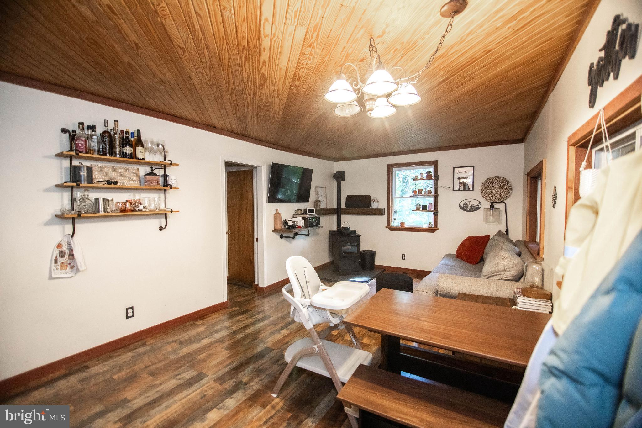 398 Acorn Road Millerstown, PA 17062 - Photo 28 of 42 Cozy living space with rustic charm.