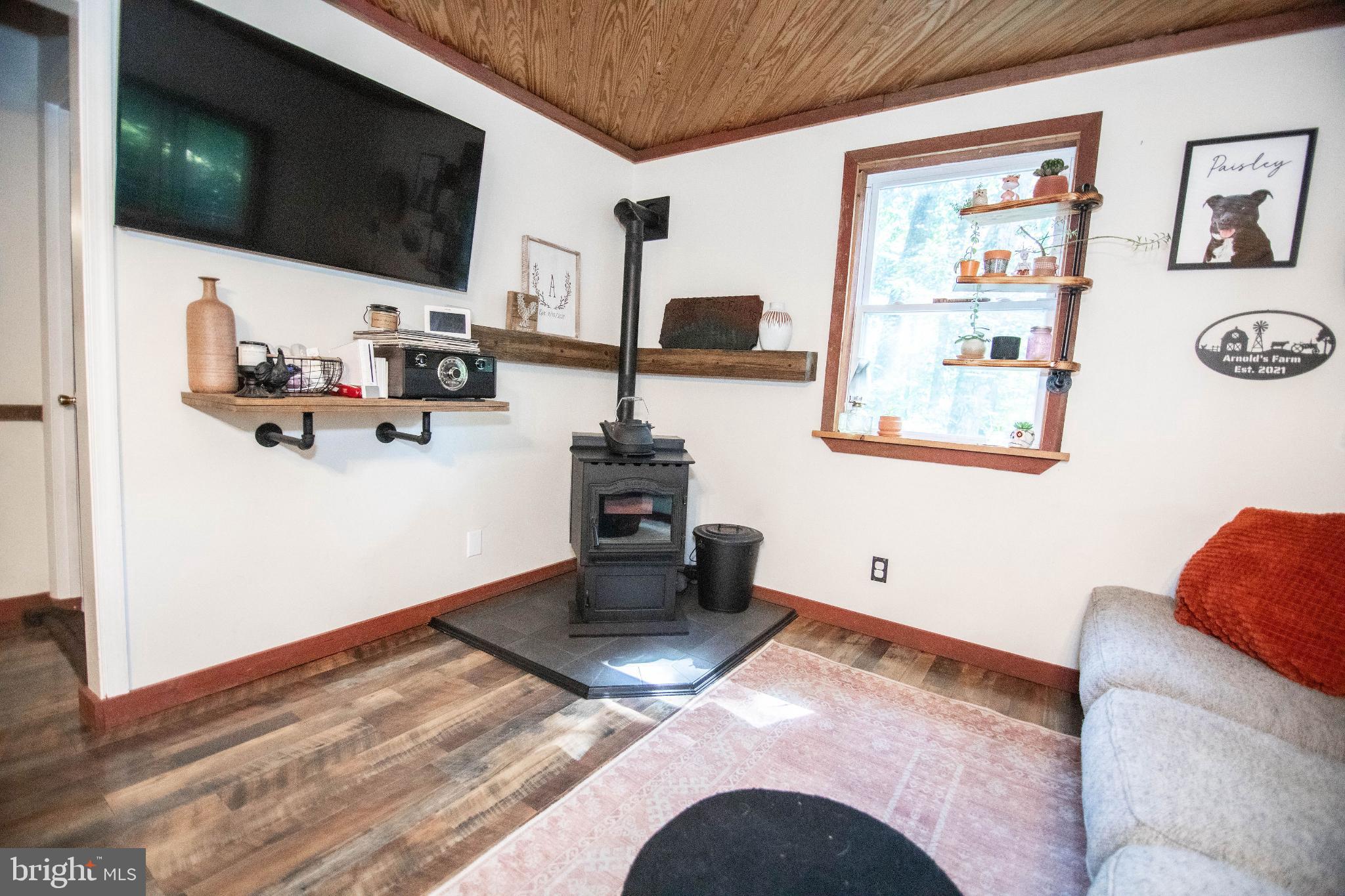 398 Acorn Road Millerstown, PA 17062 - Photo 29 of 42 Cozy living space with rustic charm.