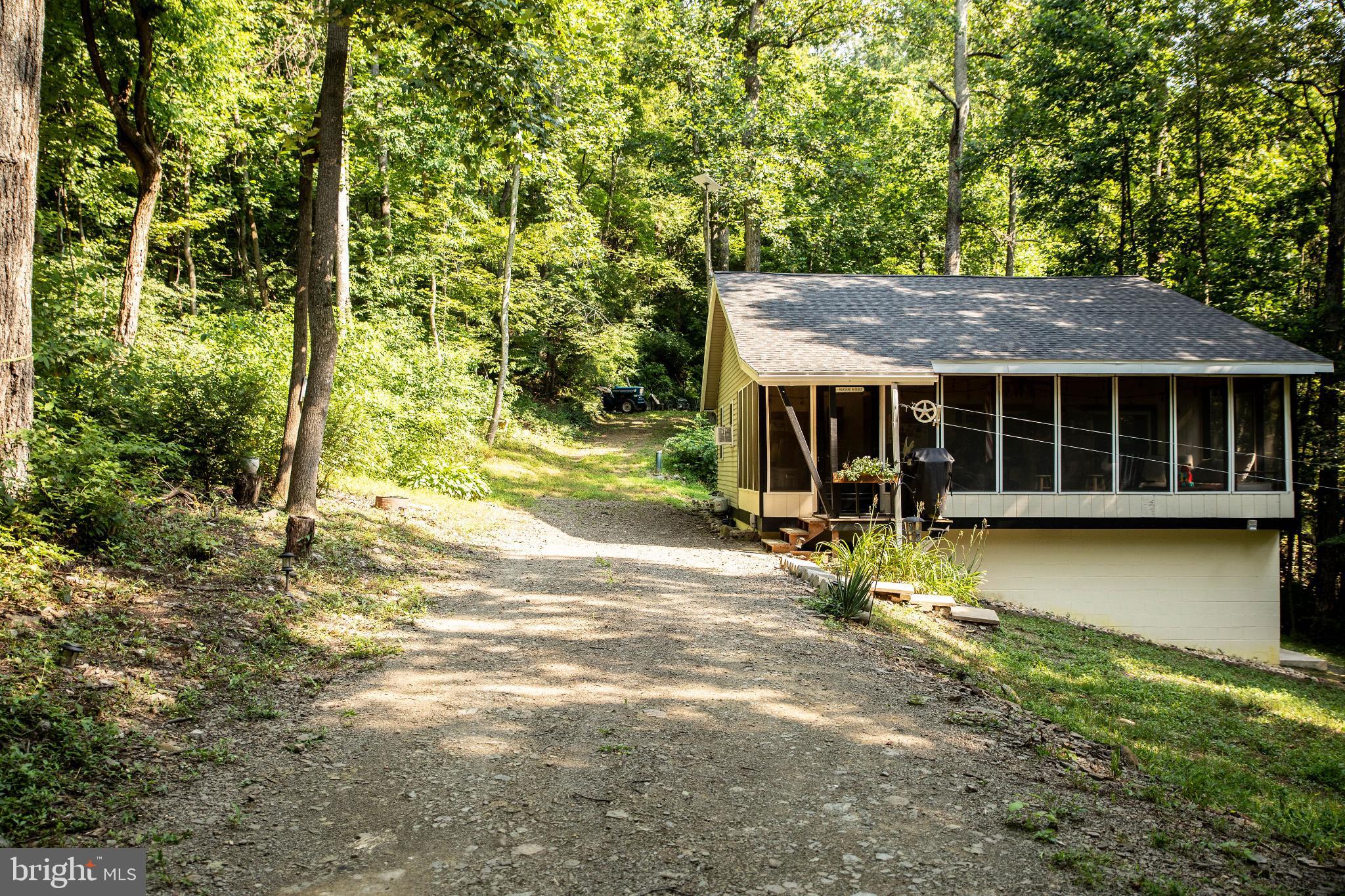 398 Acorn Road Millerstown, PA 17062 - Photo 6 of 42 Charming retreat nestled in lush greenery.