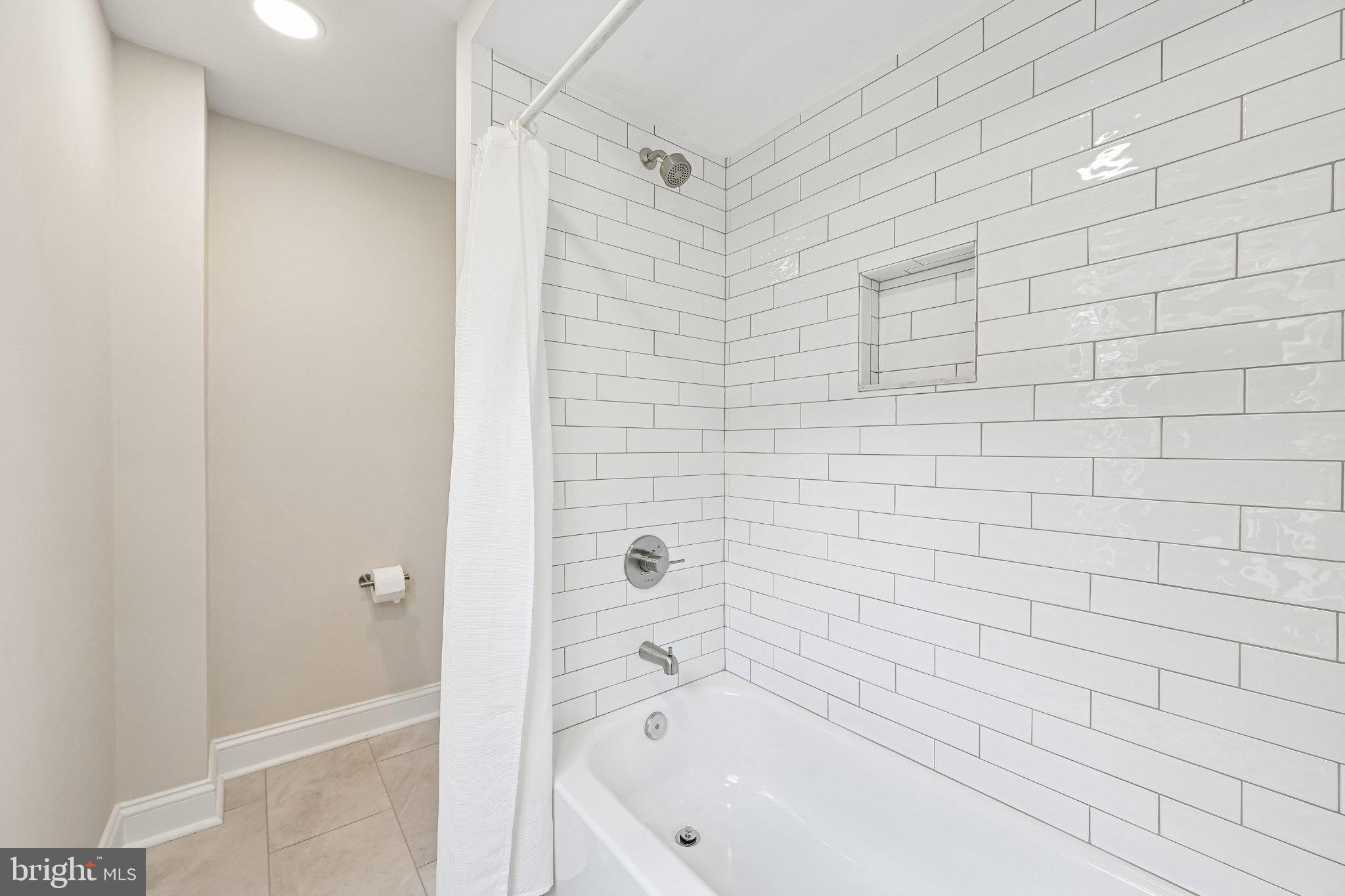 5714 Rusk Avenue Baltimore, MD 21215 - Photo 20 of 51 Sleek, modern bathroom retreat.