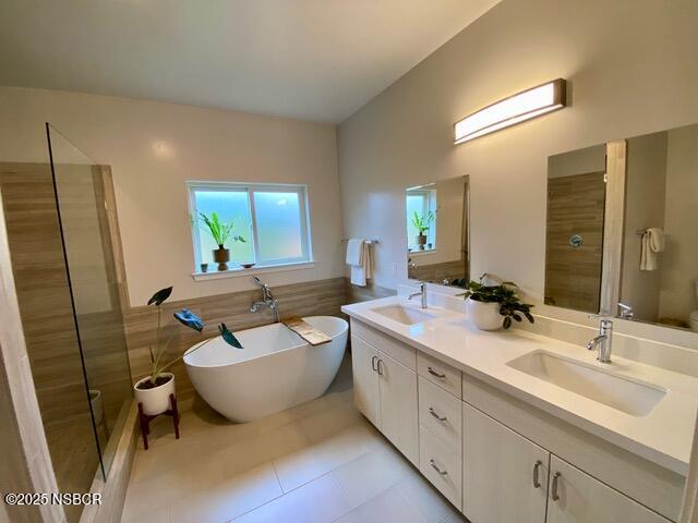 0 Old Mission Drive Solvang, CA 93463 - Photo 37 of 68 a spacious bathroom with a double vanity sink a mirror and a bathtub